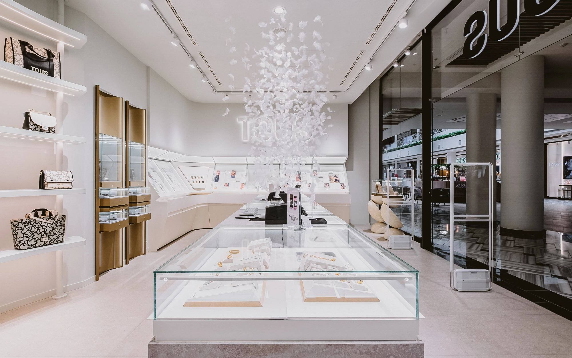 Elegant TOUS store with modern lighting designed by Lumiverso. Subtle lighting highlights the luxurious nature of the interior and the products on display.